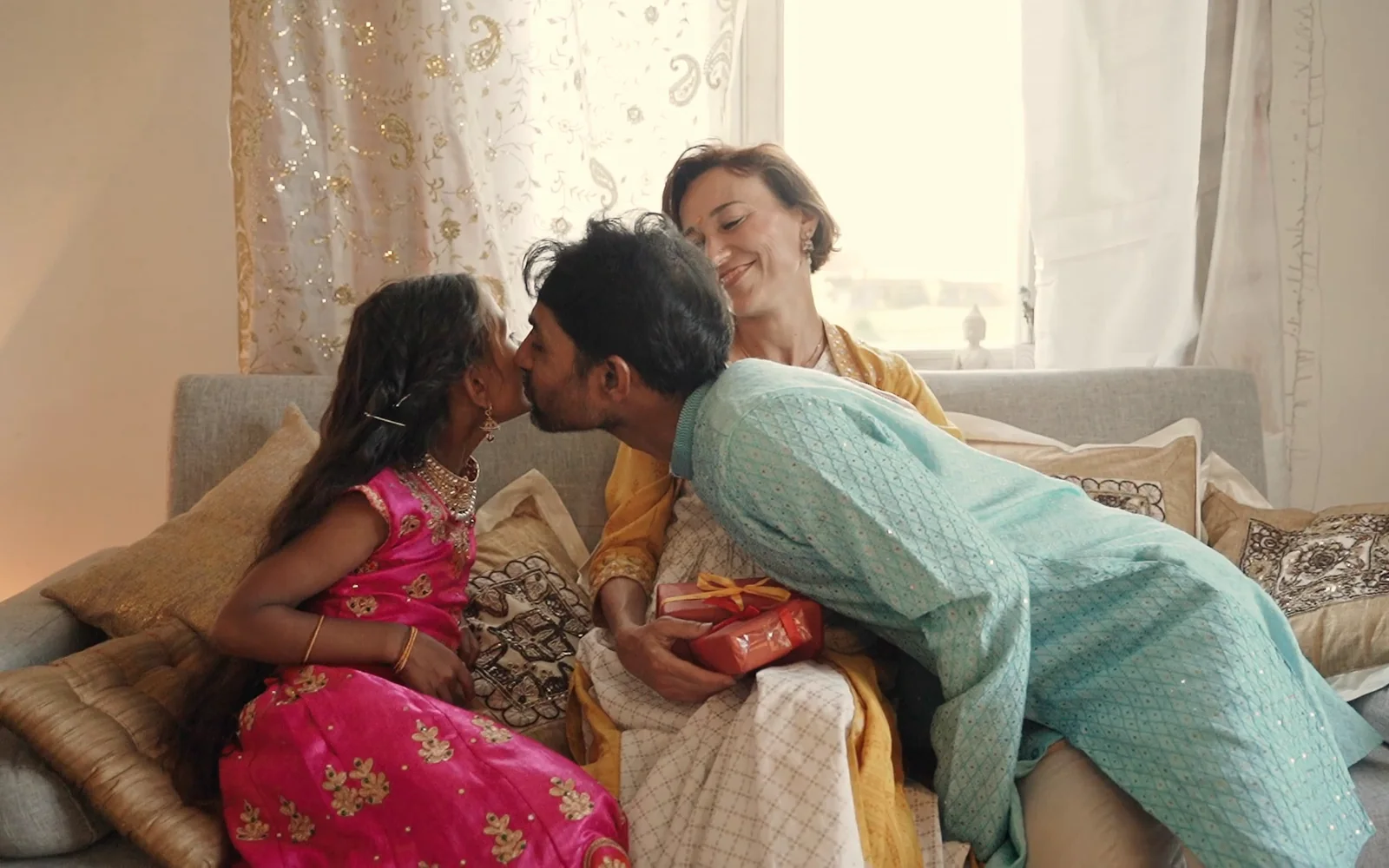 A family sharing a gift at home