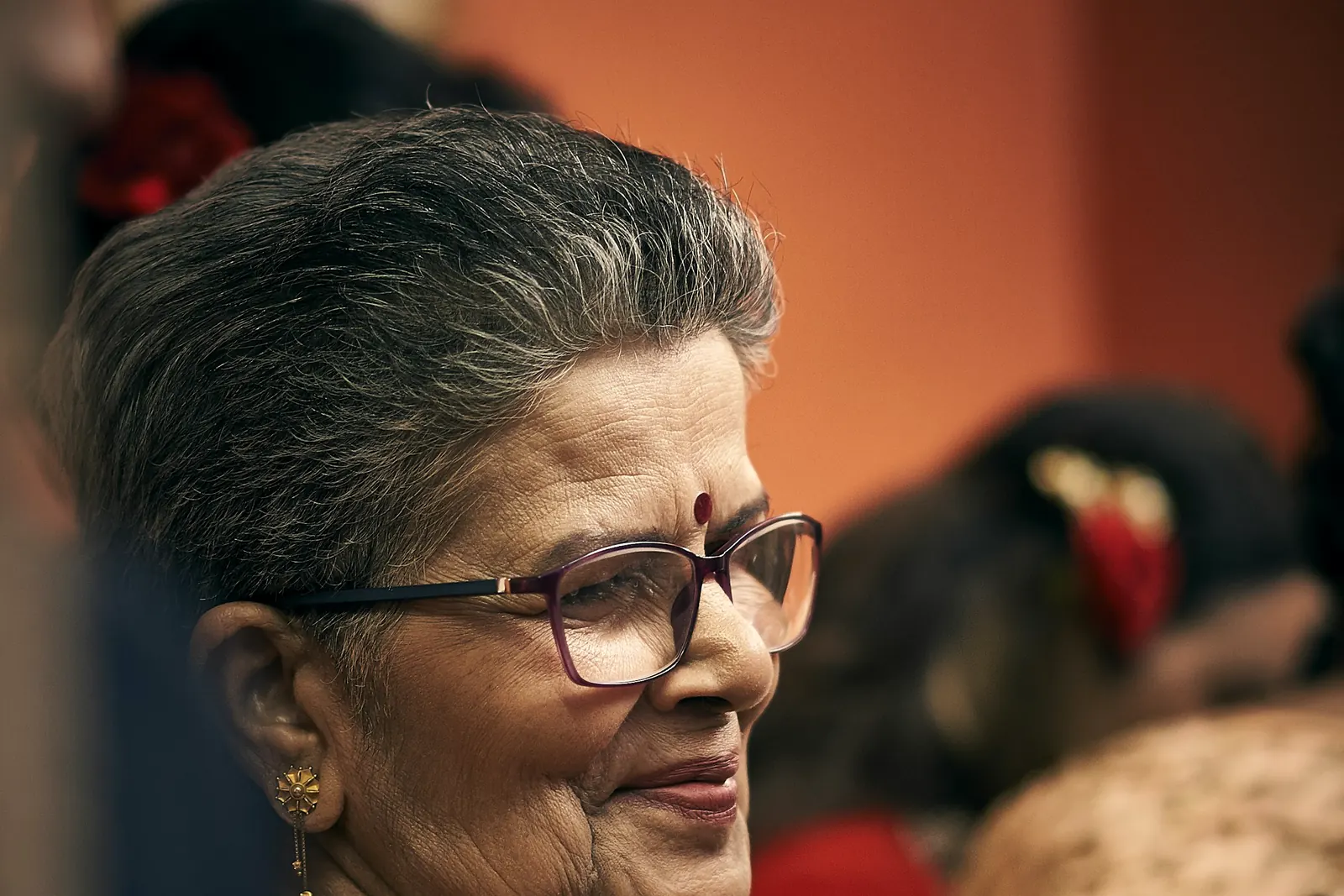 A grandmother smiling at home
