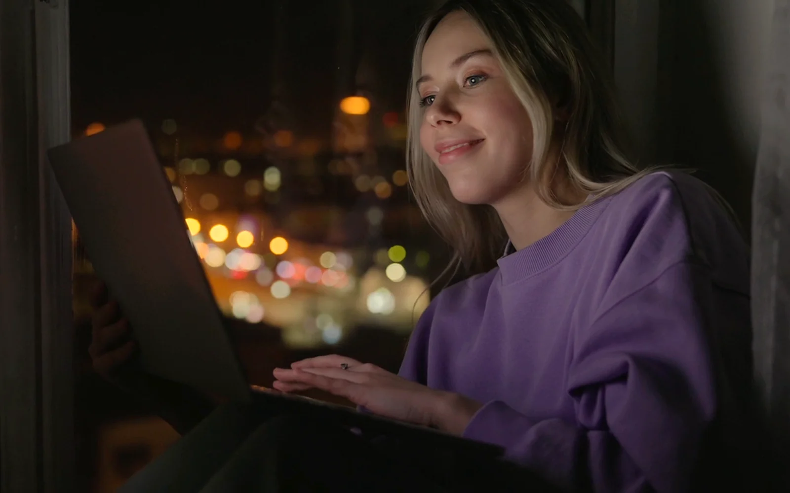 A woman shopping online at night