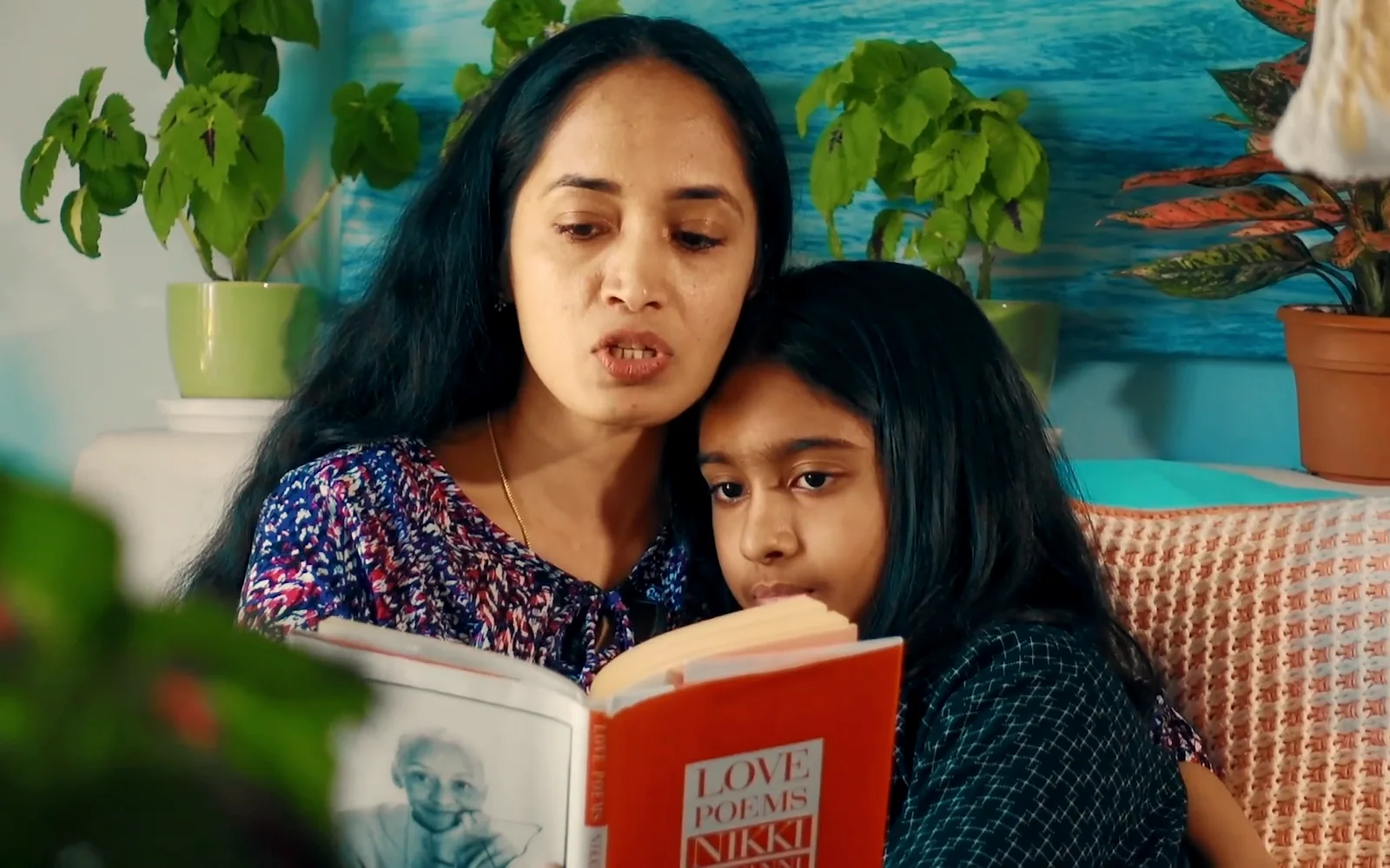 A mother reading with her daughter